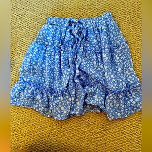 Blue skirt with white flowers.